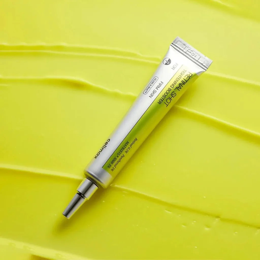 Tube Celimax The Vita A Retinal Shot Tightening Booster 15ml posé sur fond de texture crème jaune – booster fermeté au rétinal 0,1%, panthénol et Matrixyl 3000 - Kbeauty Korean Skinorea shop Europe fast delivery - skincare coréenne Skinorea shop France Paris livraison rapide
